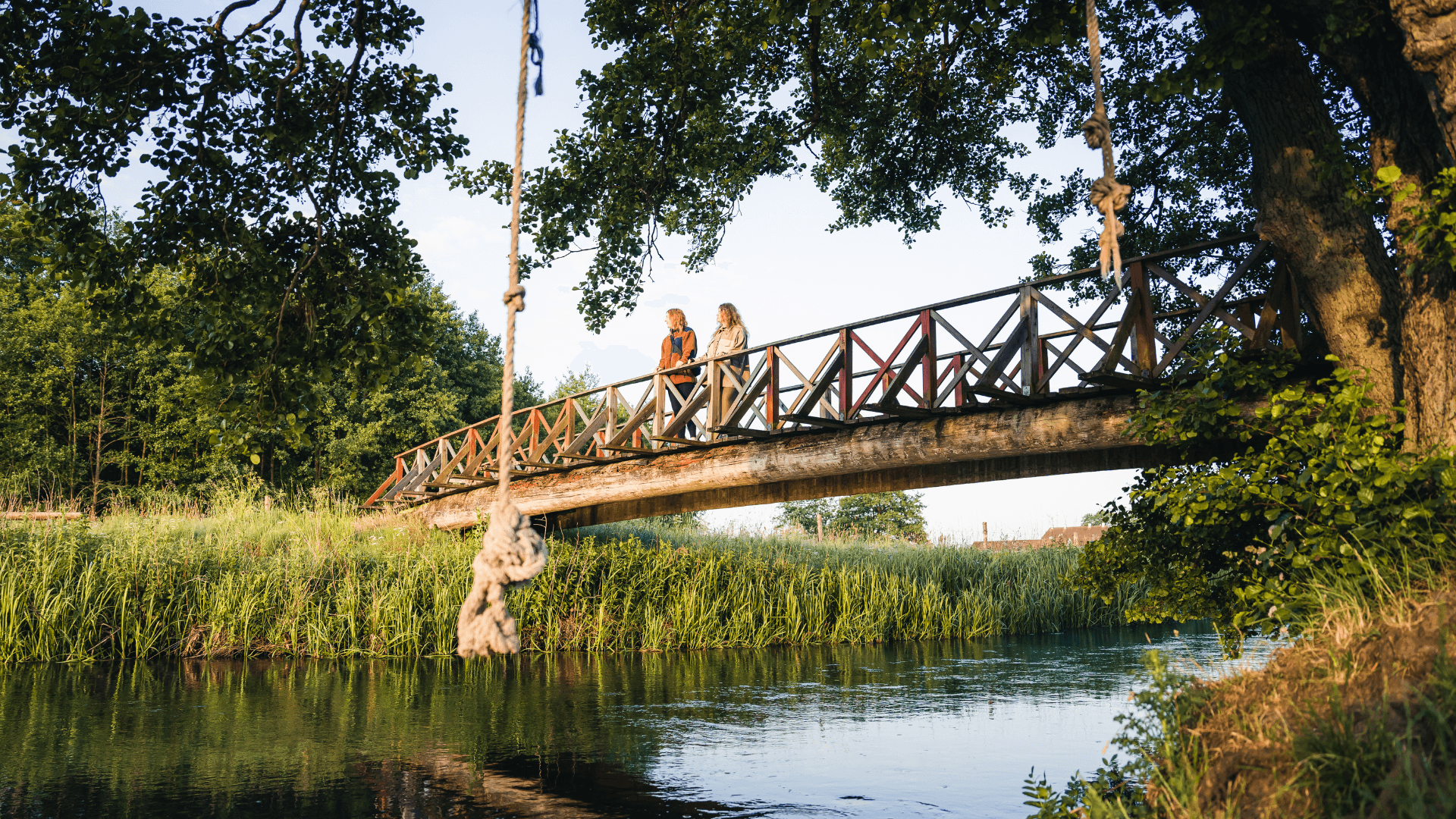Girls on a trip in Vejle Ådal by a bridge